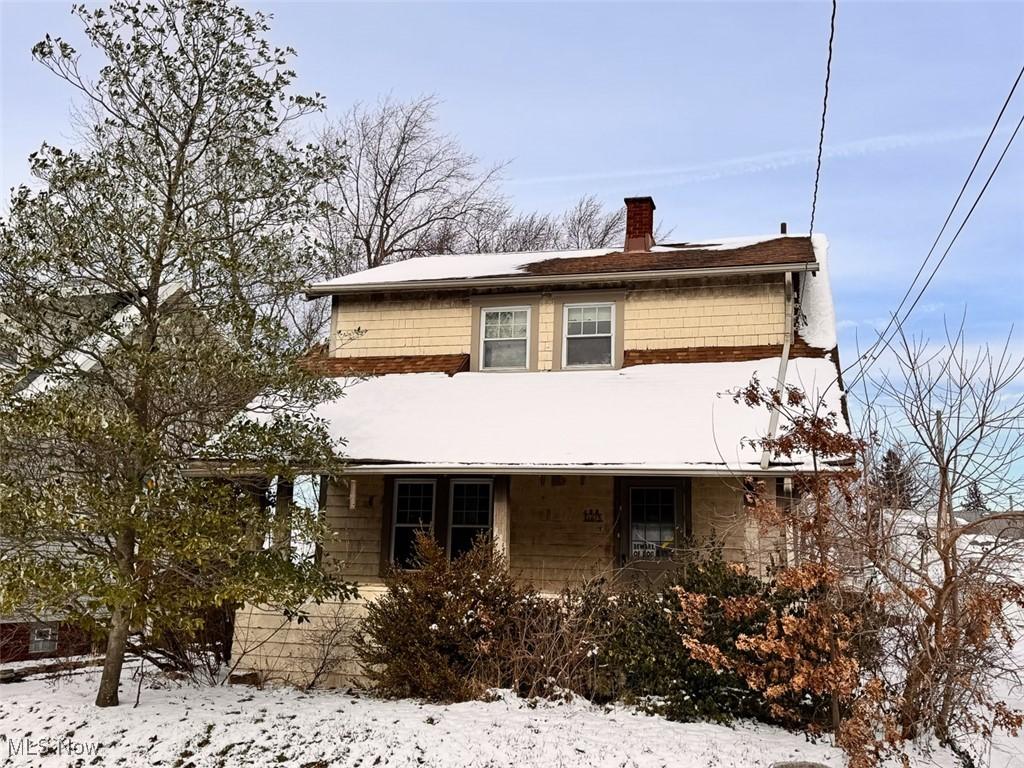 view of snow covered property