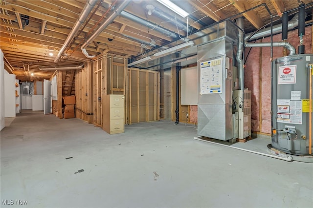 basement with gas water heater, electric panel, and heating unit