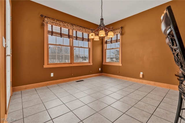 unfurnished dining area with light tile patterned flooring and a chandelier