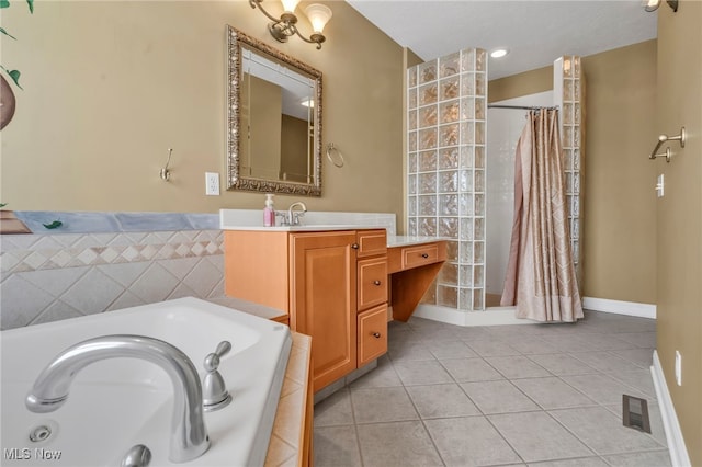 bathroom with tile patterned floors, vanity, and independent shower and bath