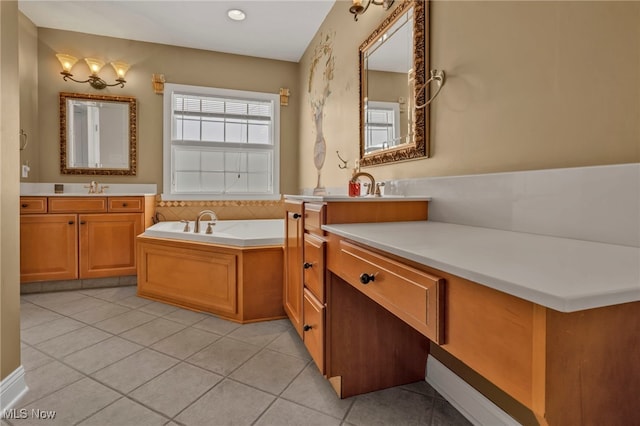 bathroom with vanity, tile patterned floors, and a tub