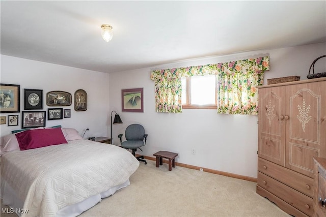 bedroom with light colored carpet