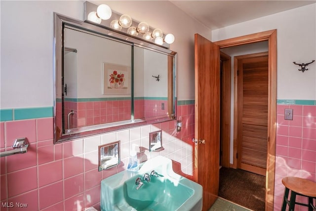 bathroom with tile walls