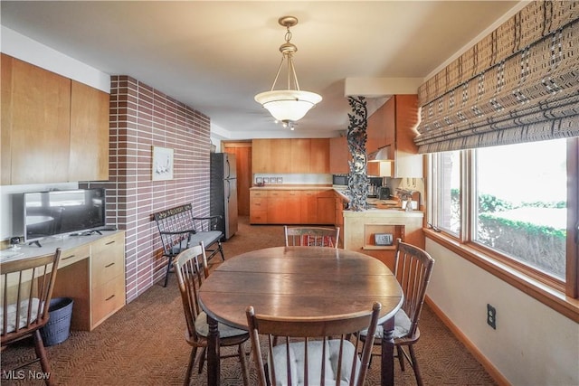 dining space with dark carpet