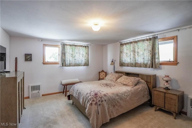 bedroom with light carpet