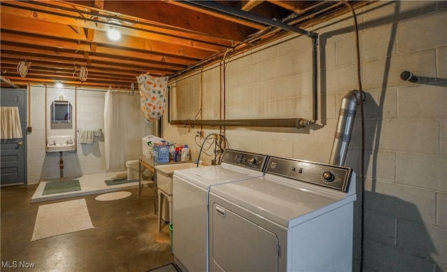 laundry room with independent washer and dryer