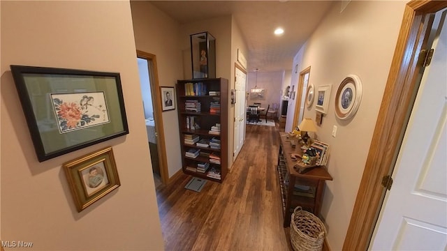 corridor with dark wood-type flooring