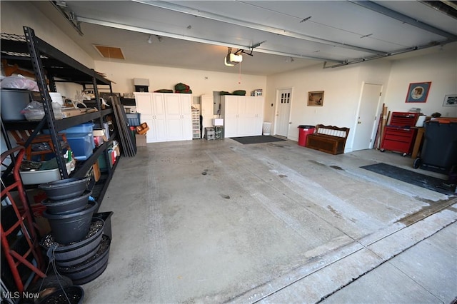 garage featuring a garage door opener