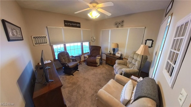 living room featuring carpet and ceiling fan