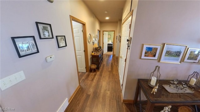 hallway featuring dark wood-type flooring