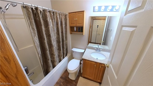 full bathroom with hardwood / wood-style flooring, vanity, shower / bath combo, and toilet