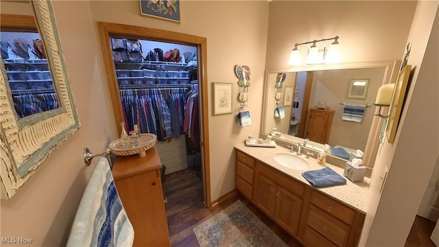 bathroom featuring vanity and wood-type flooring