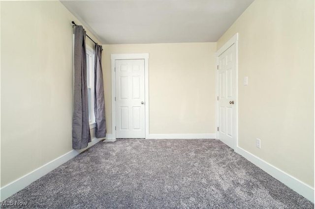 unfurnished bedroom with carpet flooring