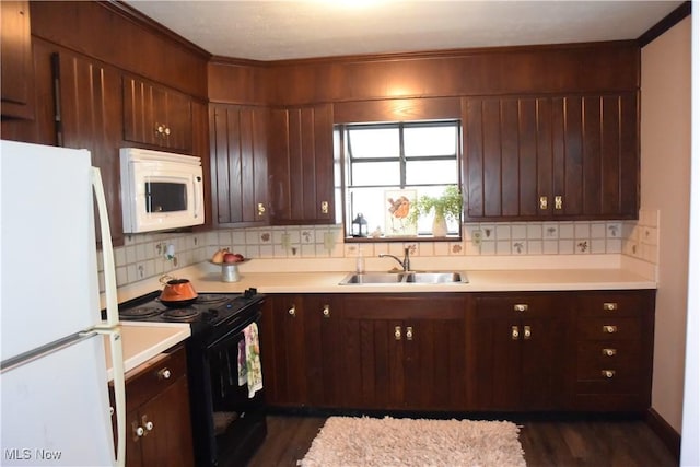 kitchen with dark hardwood / wood-style flooring, tasteful backsplash, ornamental molding, white appliances, and sink