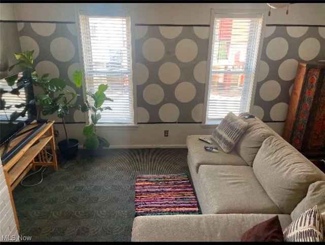 carpeted living room with a healthy amount of sunlight