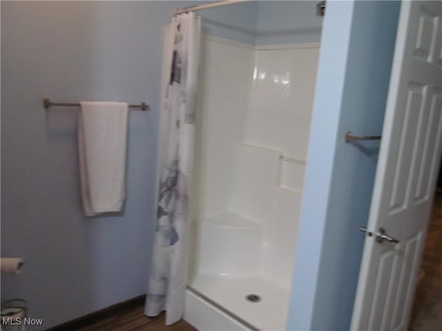 bathroom featuring a shower stall