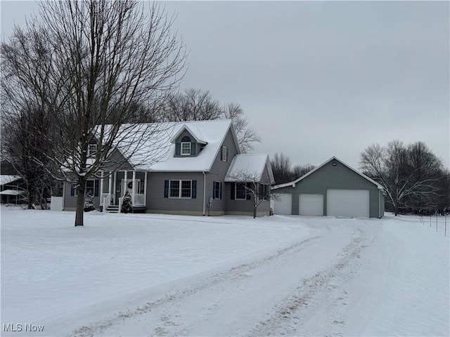 view of front facade featuring a garage and an outdoor structure