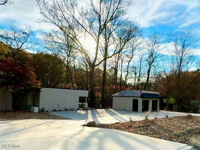 exterior space with an outbuilding and a garage