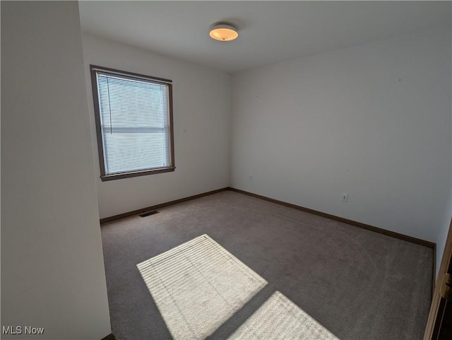 view of carpeted spare room