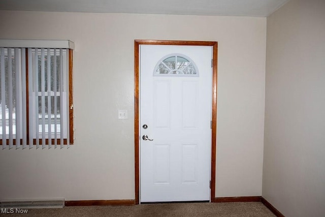 foyer featuring carpet