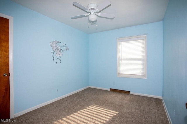 empty room with carpet flooring and ceiling fan