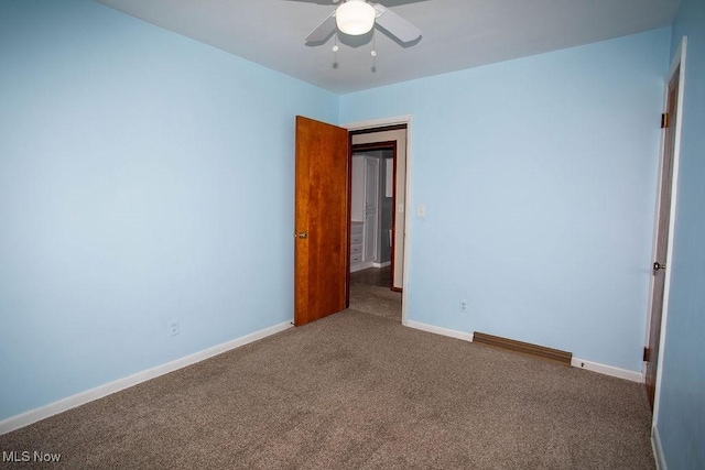 unfurnished bedroom featuring carpet flooring and ceiling fan