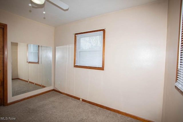 unfurnished bedroom with carpet and ceiling fan