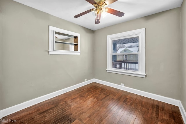 unfurnished room with hardwood / wood-style floors and ceiling fan