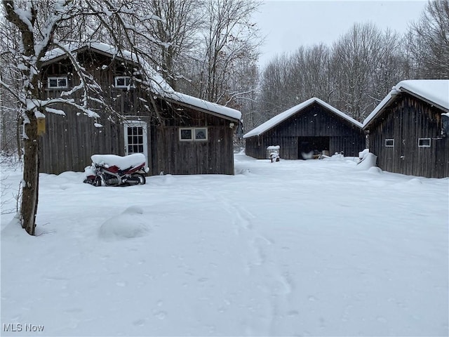 3029 Sweet Rd, Conneaut, OH 44030 - yard covered in snow featuring an outdoor structure