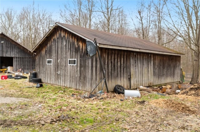 3029 Sweet Rd, Conneaut, OH 44030 - view of side of home with an outdoor structure and an outbuilding