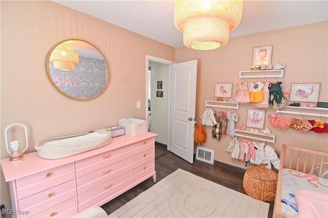 bedroom featuring dark wood-type flooring