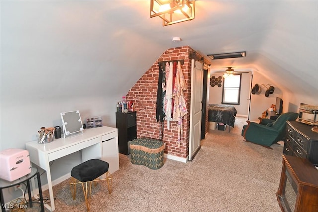 office space with ceiling fan, carpet floors, and lofted ceiling