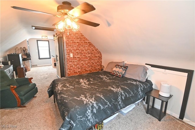 bedroom with ceiling fan, carpet, brick wall, and vaulted ceiling