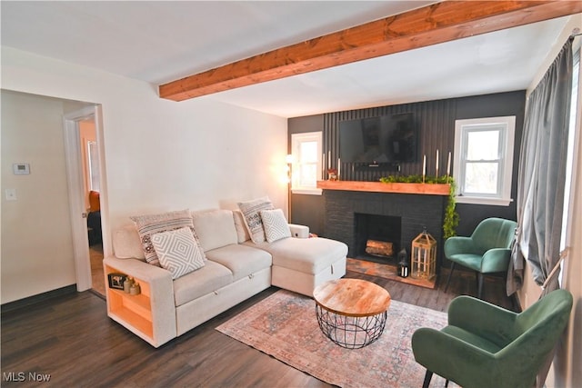 living room with dark hardwood / wood-style floors and a brick fireplace