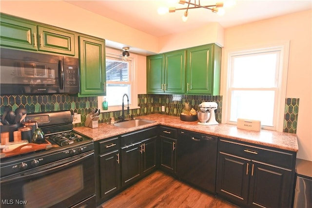 kitchen with black appliances, decorative backsplash, dark hardwood / wood-style floors, and sink