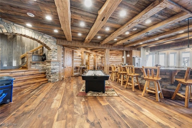 playroom featuring wood ceiling, beamed ceiling, and wood-type flooring