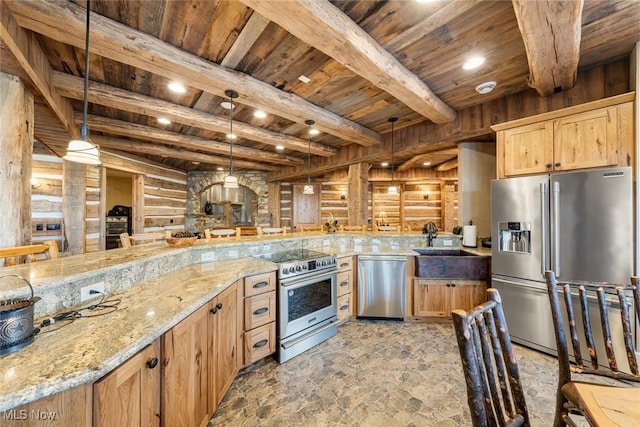 kitchen with wooden walls, light stone countertops, beamed ceiling, decorative light fixtures, and stainless steel appliances