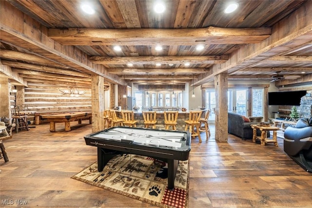 playroom featuring beam ceiling, ceiling fan, log walls, wooden ceiling, and wood-type flooring