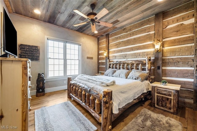 bedroom with ceiling fan, wooden ceiling, and light hardwood / wood-style flooring