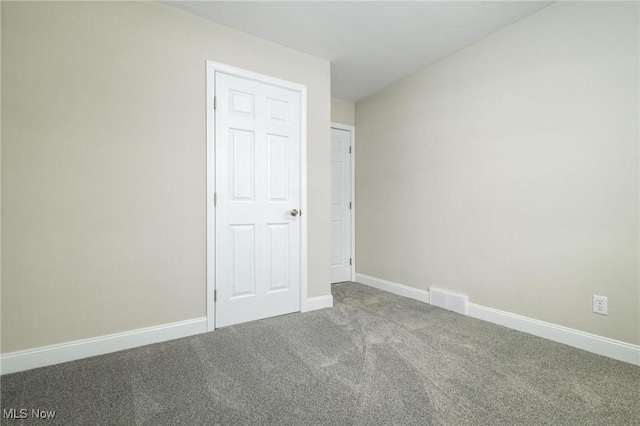 spare room with carpet flooring