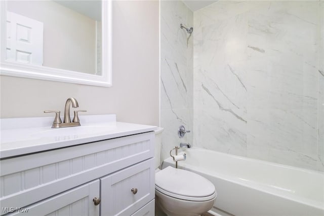 full bathroom featuring vanity, toilet, and tiled shower / bath