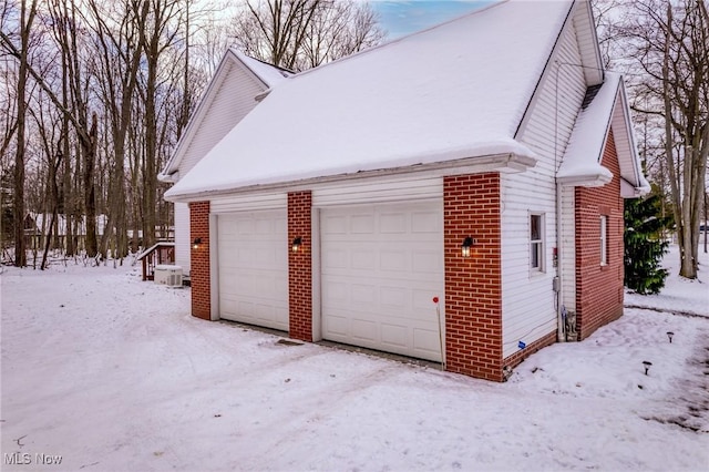 view of snow covered garage