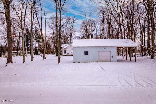 view of snow covered garage