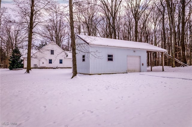 view of snow covered garage