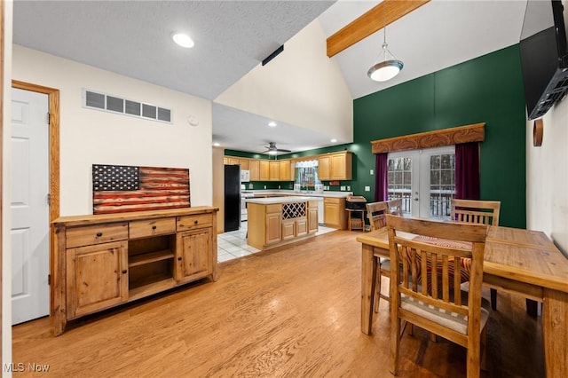 dining room with high vaulted ceiling, light wood finished floors, a ceiling fan, recessed lighting, and beam ceiling