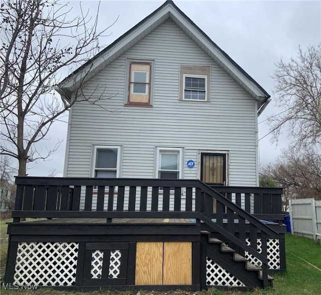 rear view of house with a wooden deck