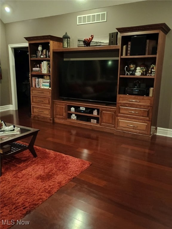 living room with dark hardwood / wood-style floors