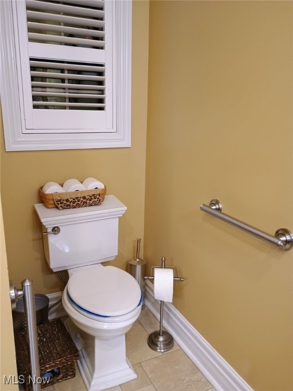 bathroom featuring tile patterned flooring and toilet