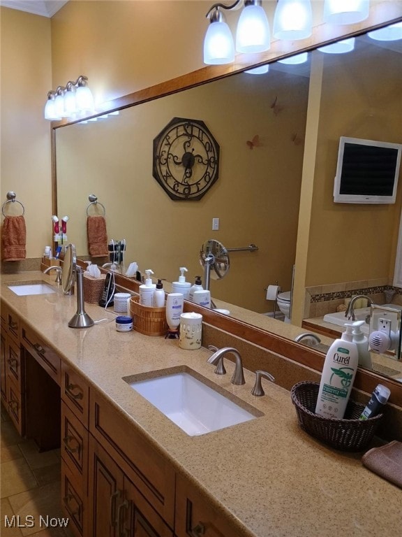 bathroom with tile patterned floors, vanity, and toilet