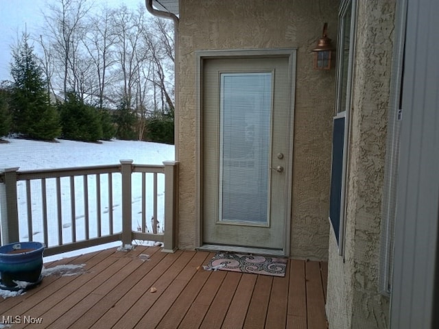 view of snow covered property entrance